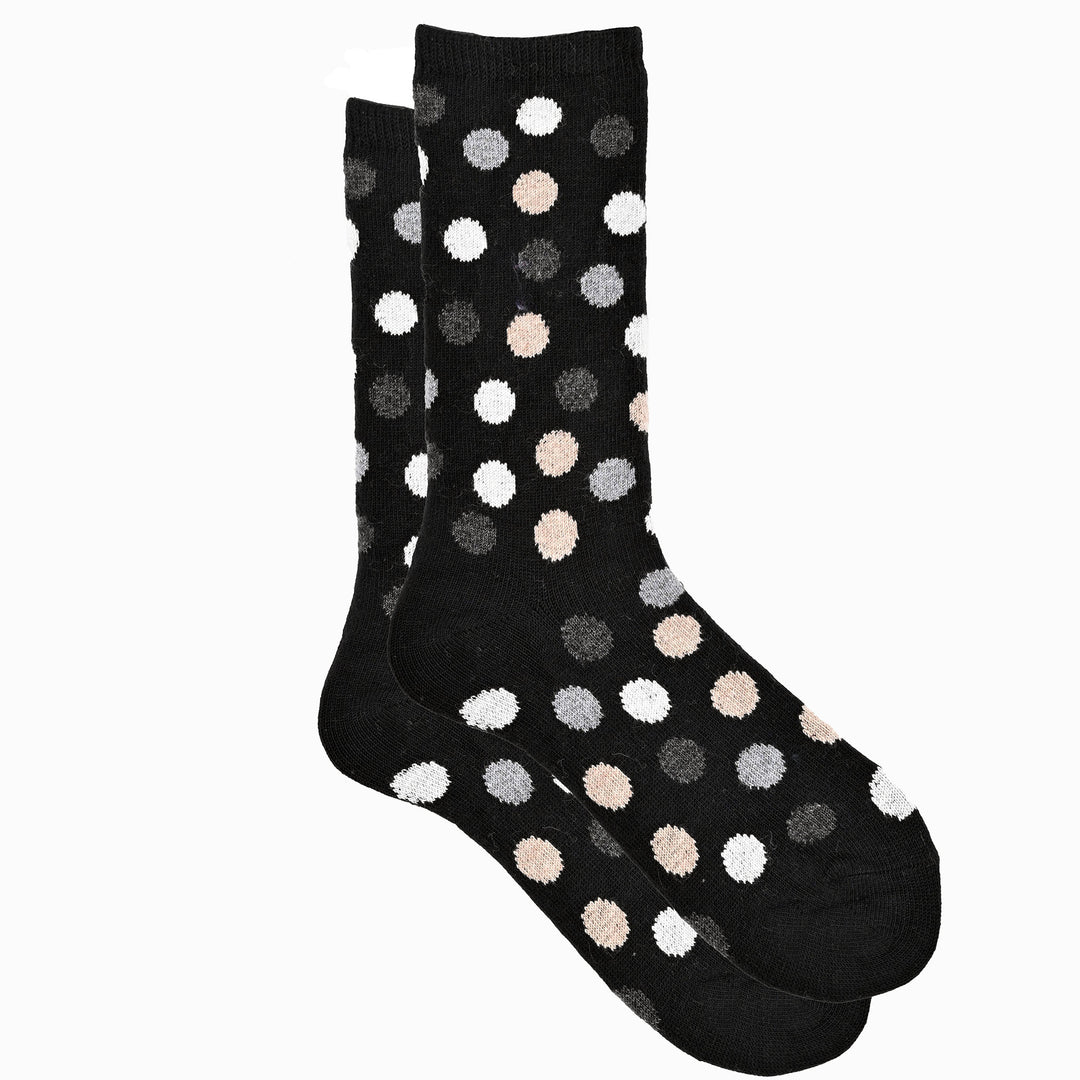 A pair of black crew socks with a multicolored dot pattern.