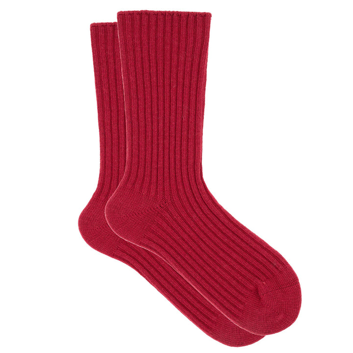 A pair of red ribbed crew socks made from a cashmere, silk, and tencel blend.
