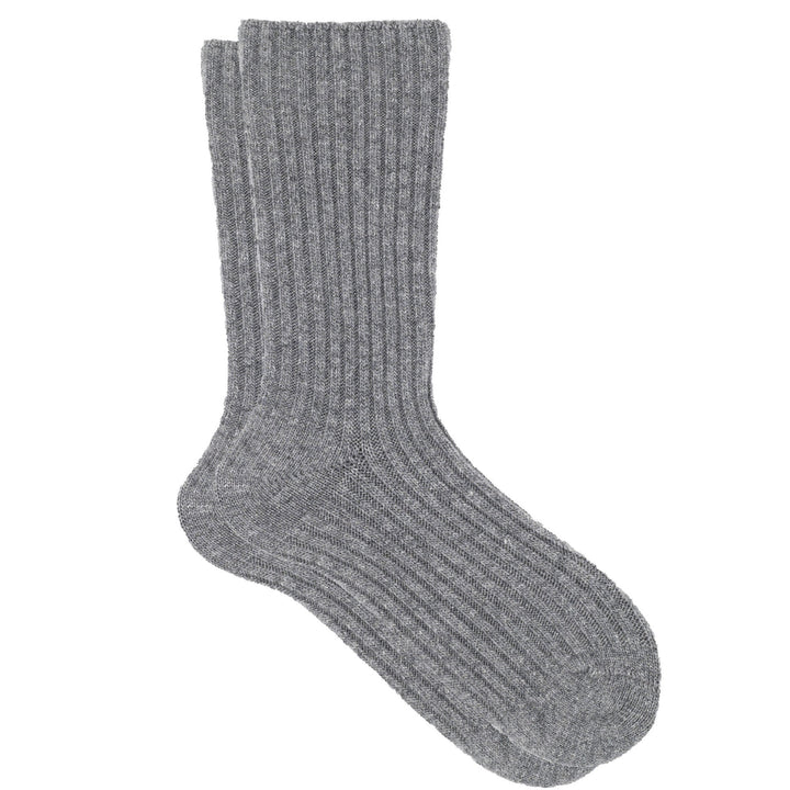 A pair of gray ribbed crew socks made from a cashmere, silk, and tencel blend.