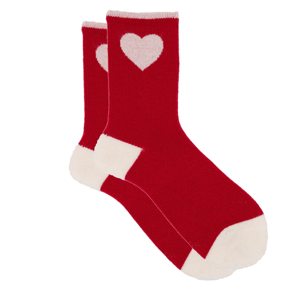 Red socks with white hearts on a white background