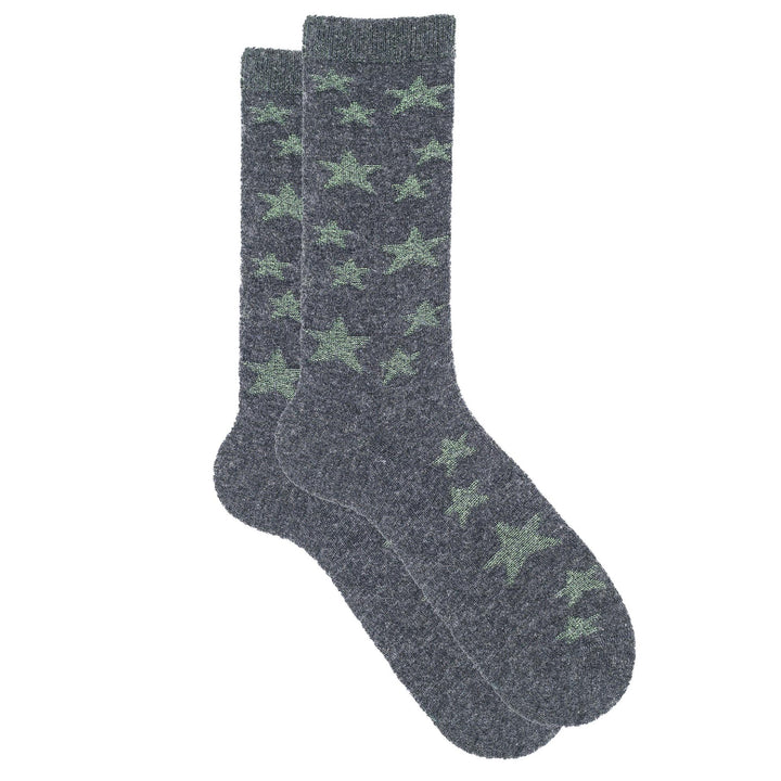 Gray socks with green star patterns on a white background