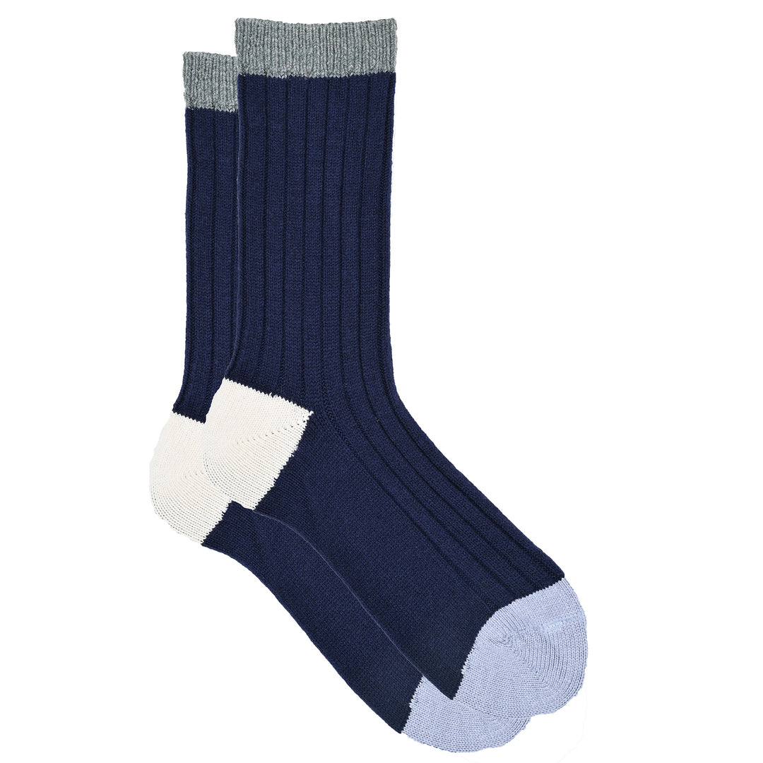 A pair of color block ribbed knit socks, featuring blue with pink, and light blue blocks, and a comfortable cuff.