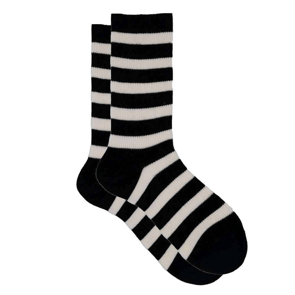 A pair of cozy cashmere silk striped ribbed crew socks in black and beige color pattern.