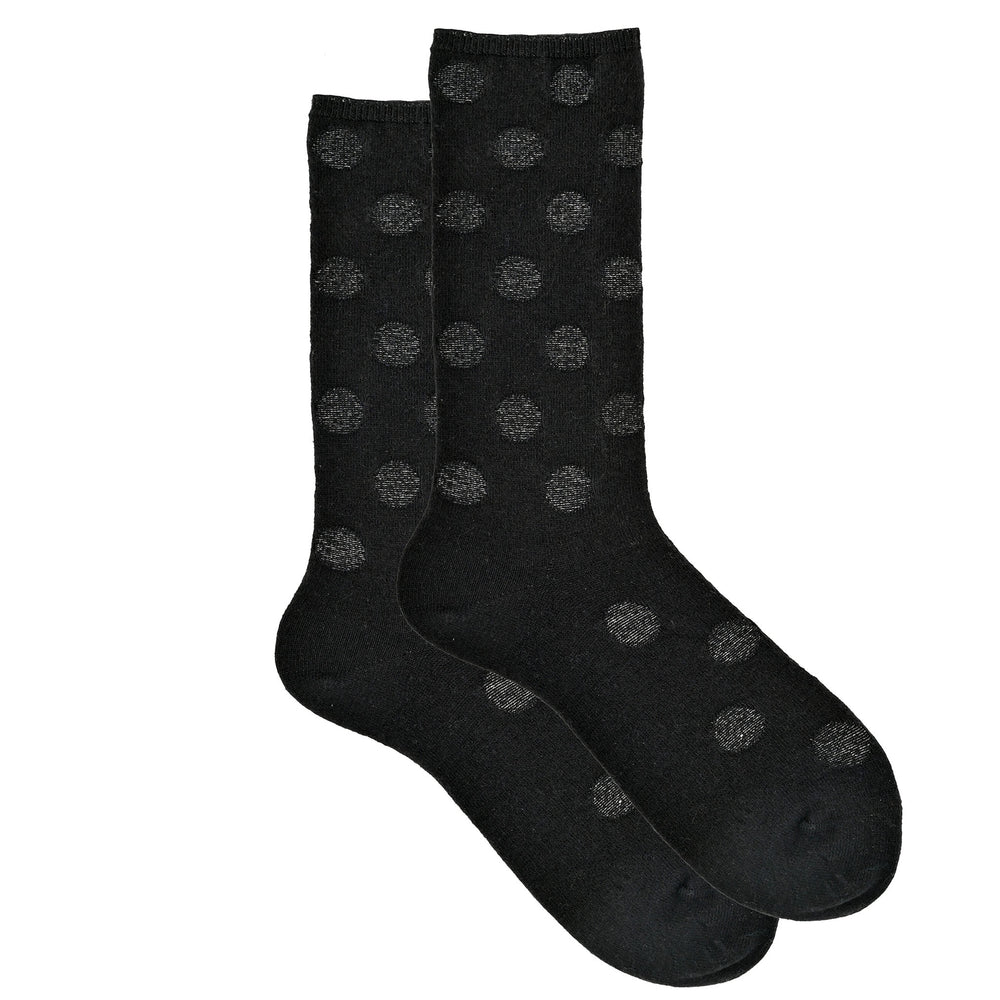 A pair of black cashmere silk blend crew socks with reverse dot pattern