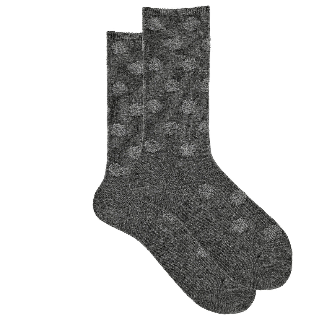 A pair of grey cashmere silk blend crew socks with reverse dot pattern