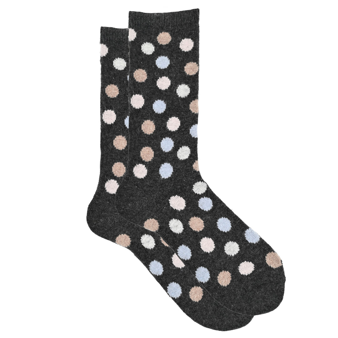 A pair of black crew socks with a multicolored dot pattern.