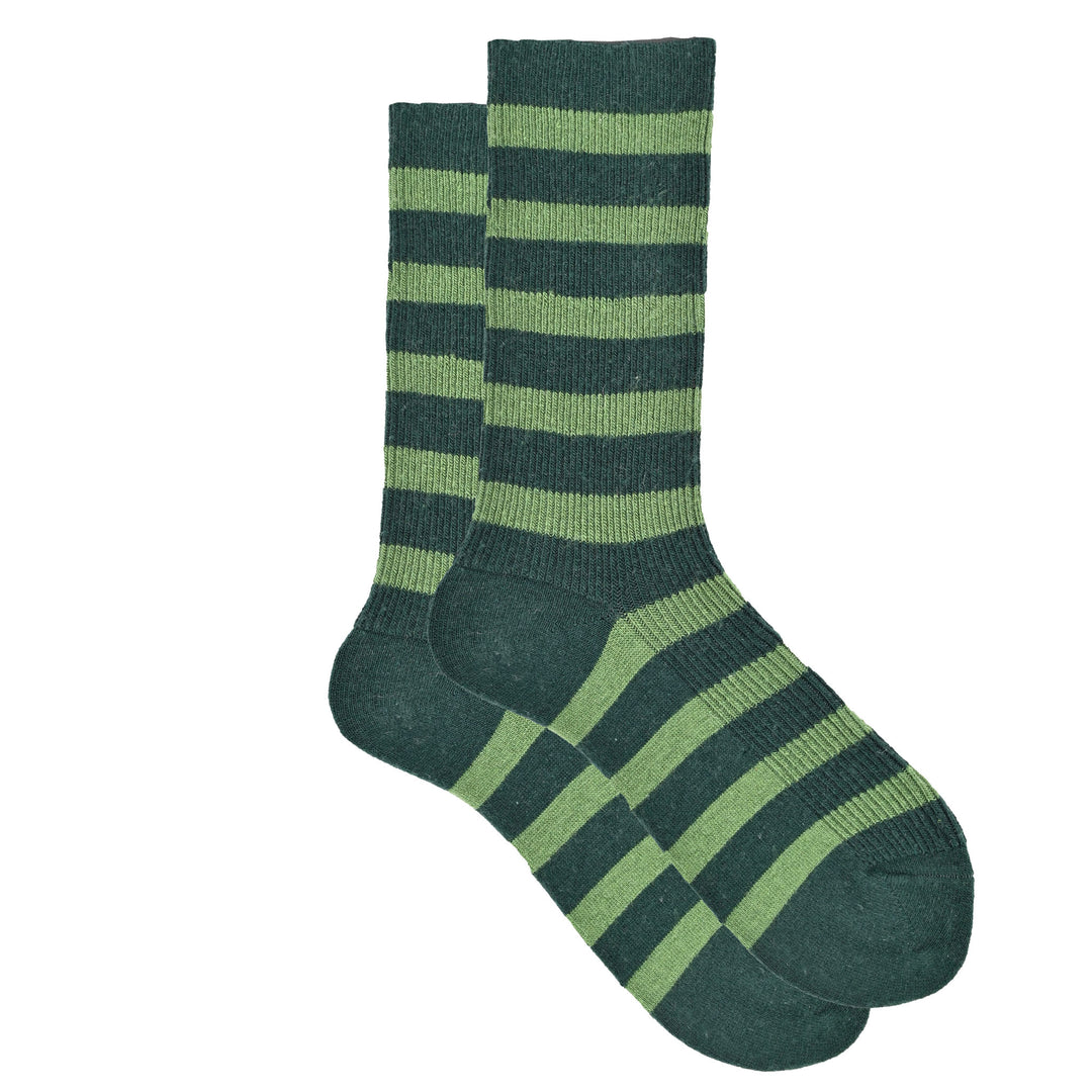Green and navy striped sock on a white background