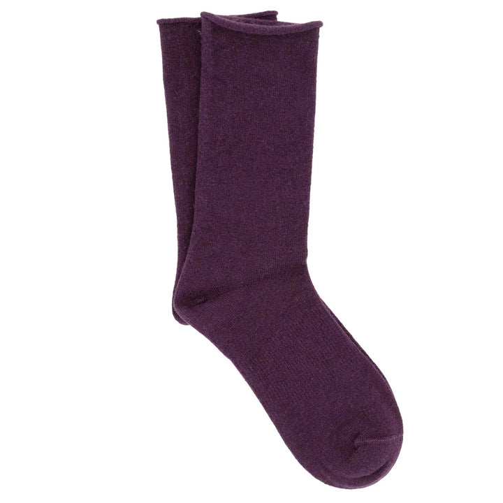 A pair of fucsia roll top socks made from a cashmere, silk, tencel blend.