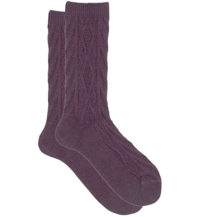 A pair of fucsia cashmere silk jacquard crew socks with a cozy knit pattern.