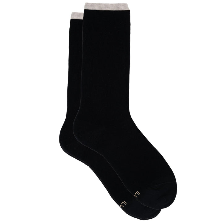 Two black socks on a white background