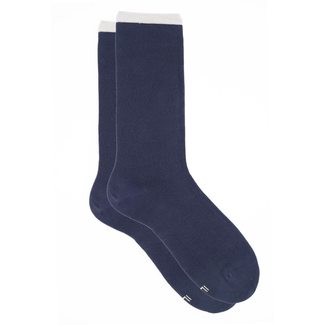 Pair of navy blue socks on a white background
