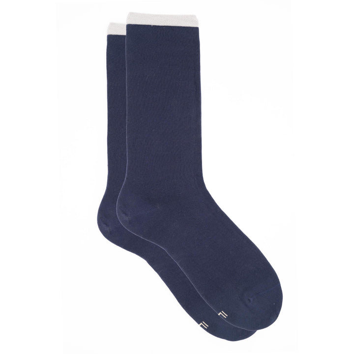 Pair of navy blue socks on a white background