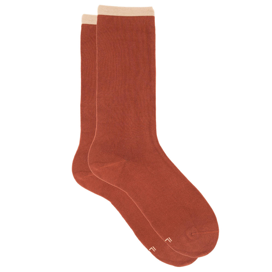 Pair of brown socks on a white background