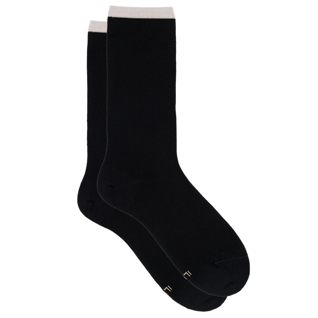 Black socks with white toes on a white background