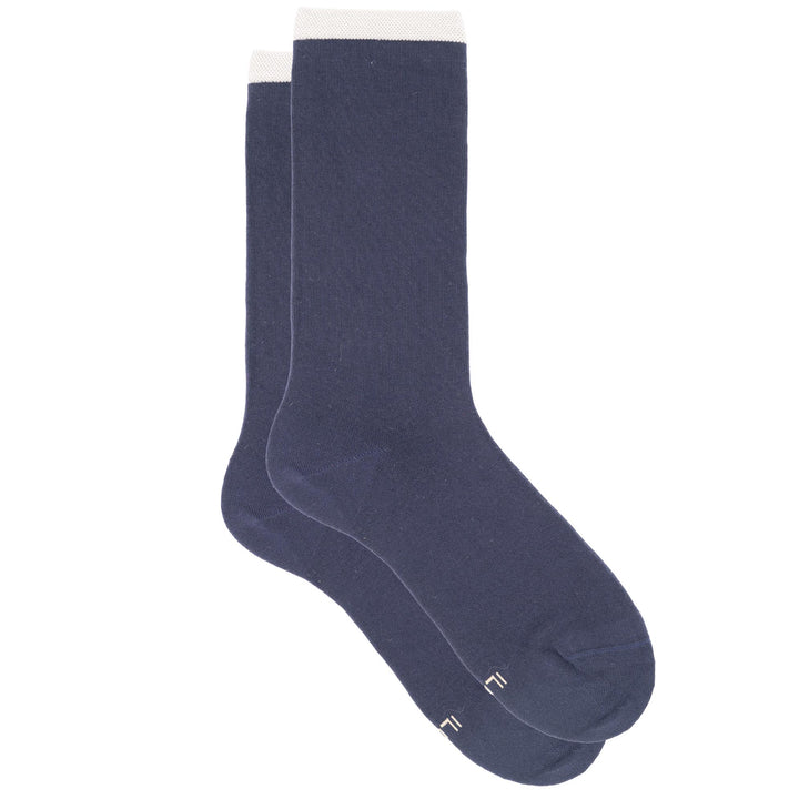 Pair of navy socks with white trim on a white background