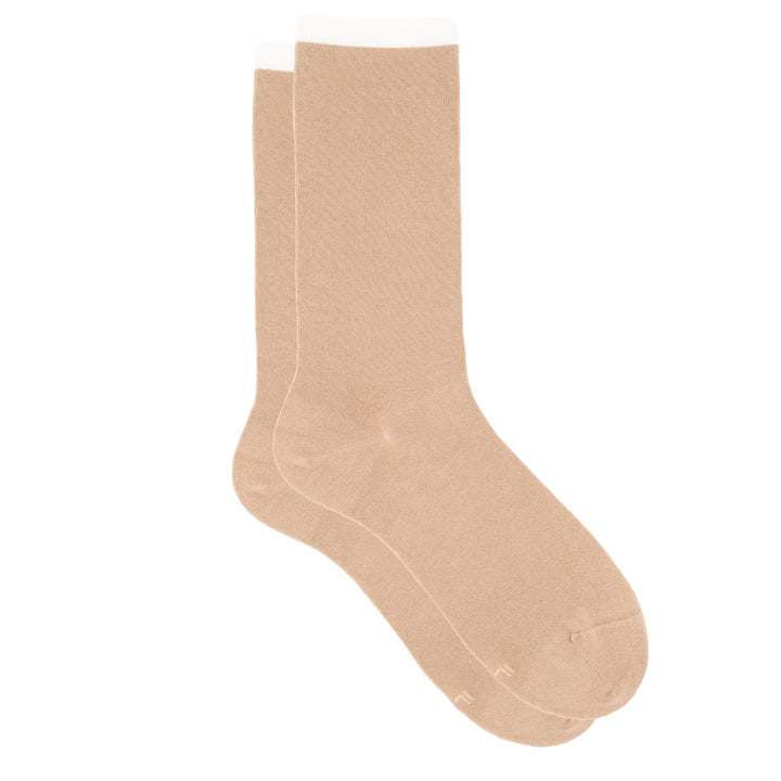Pair of beige socks on a white background