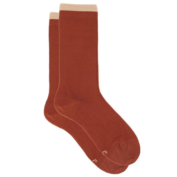 Pair of brown socks on a white background