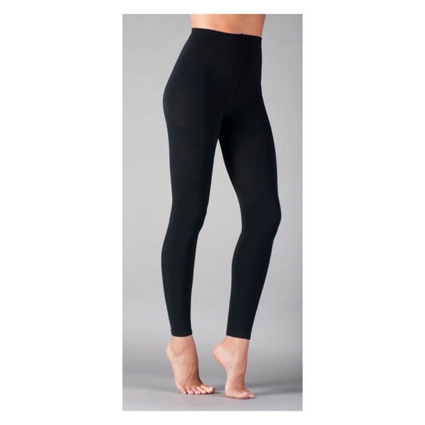 Black leggings worn by a person on a gray background