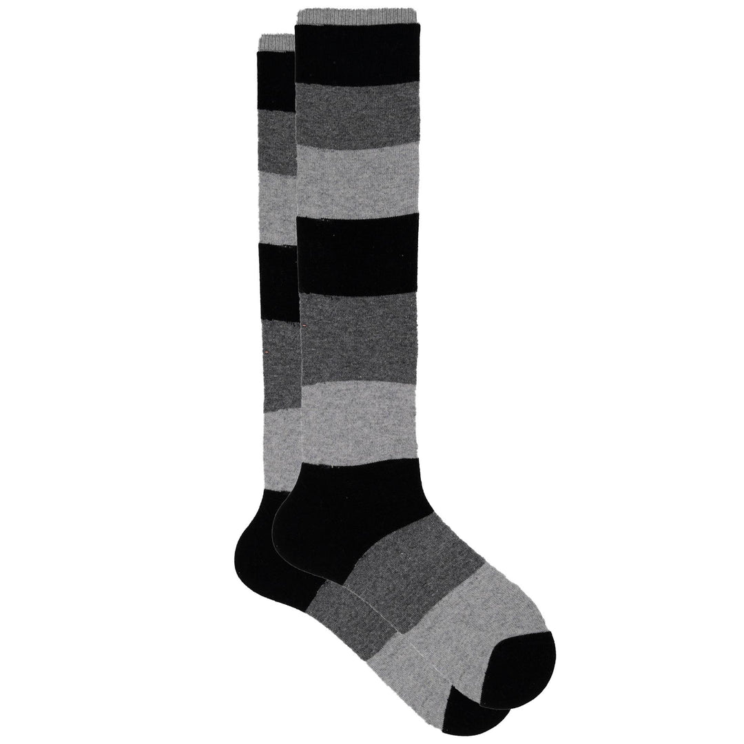 A pair of colorblock knee-high socks with stripes in black and gray shades, showing the side profile.