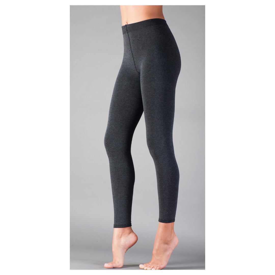 Dark gray leggings worn by a person on a gray background