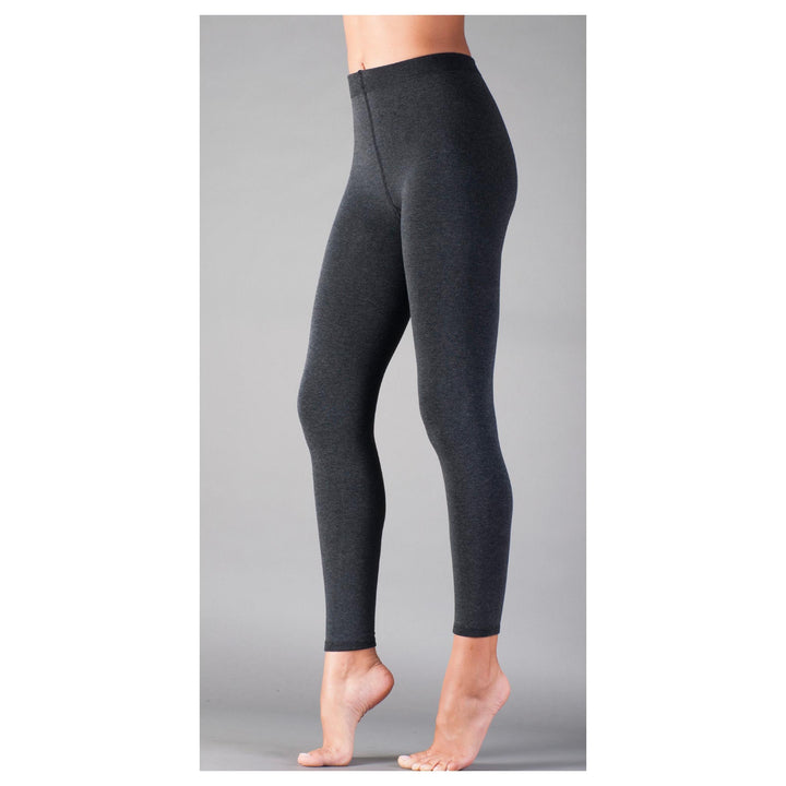 Dark gray leggings worn by a person on a gray background