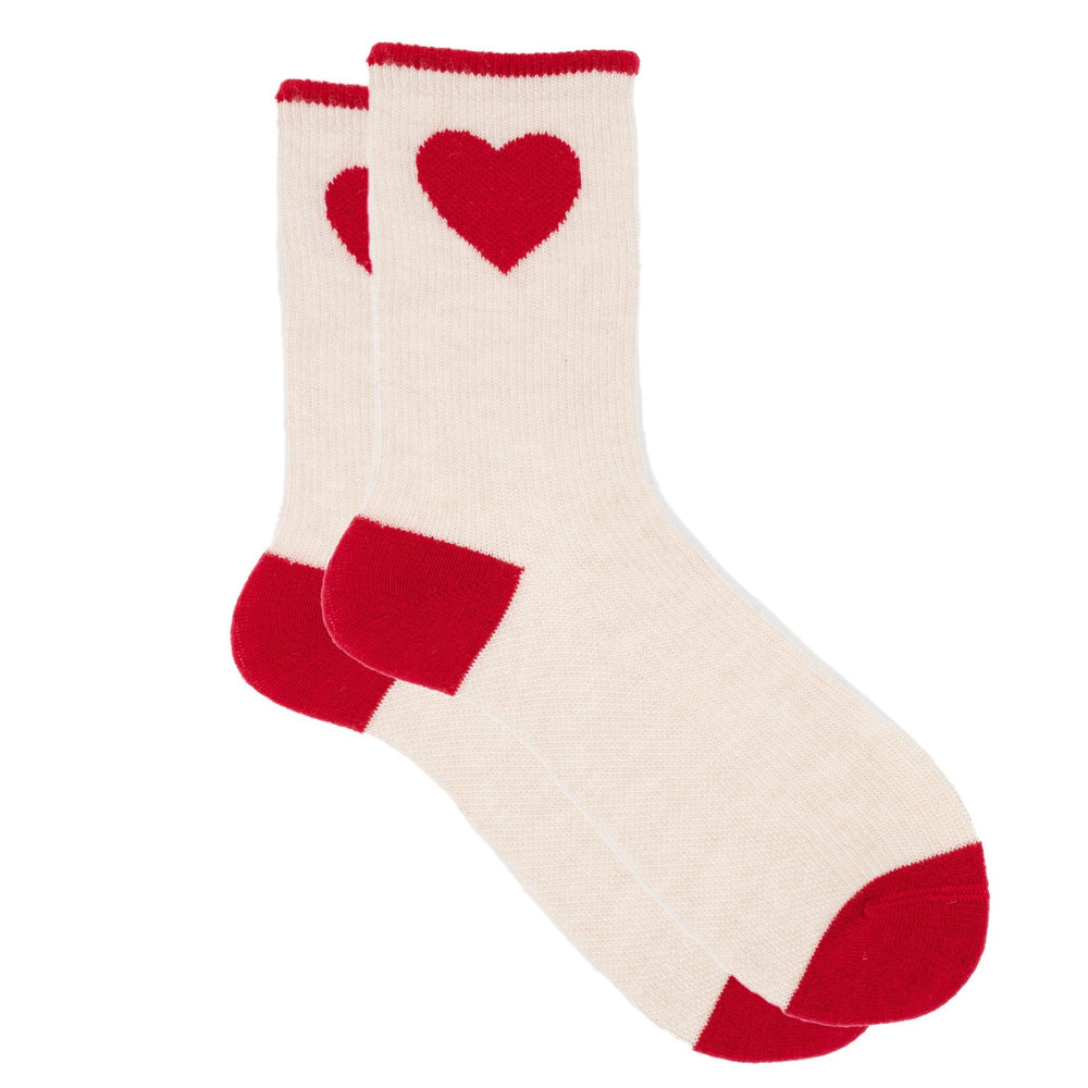 White socks with red hearts and cuffs on a white background