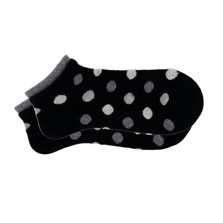 A pair of black cashmere silk dotted sneaker socks with a seamless toe and hand-linked design.