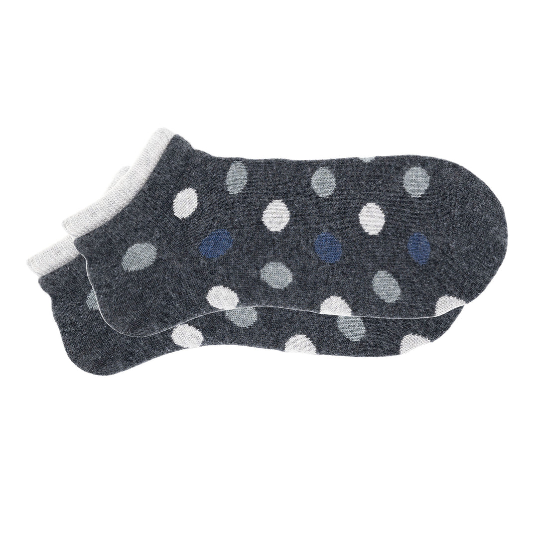 A pair of grey cashmere silk dotted sneaker socks with a seamless toe and hand-linked design.