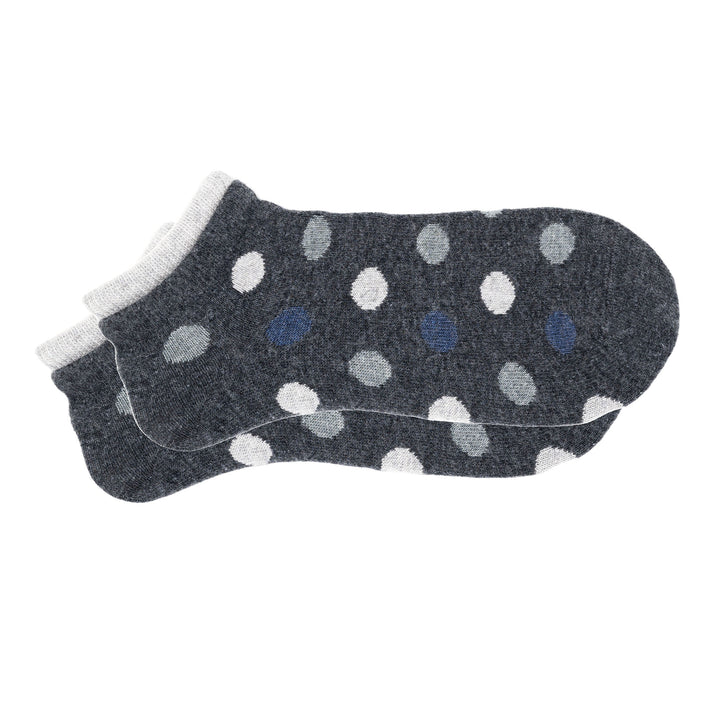 A pair of grey cashmere silk dotted sneaker socks with a seamless toe and hand-linked design.