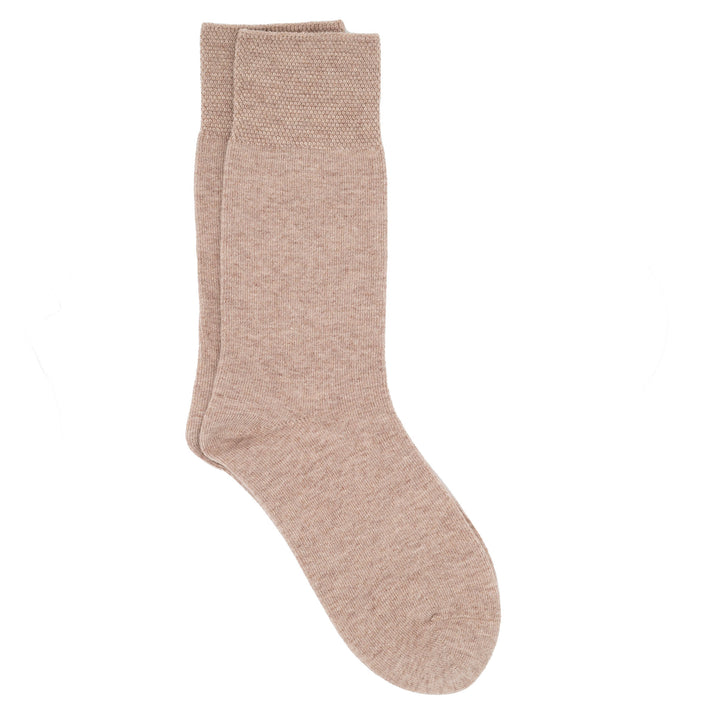 A pair of beige crew socks with a pique cuff.